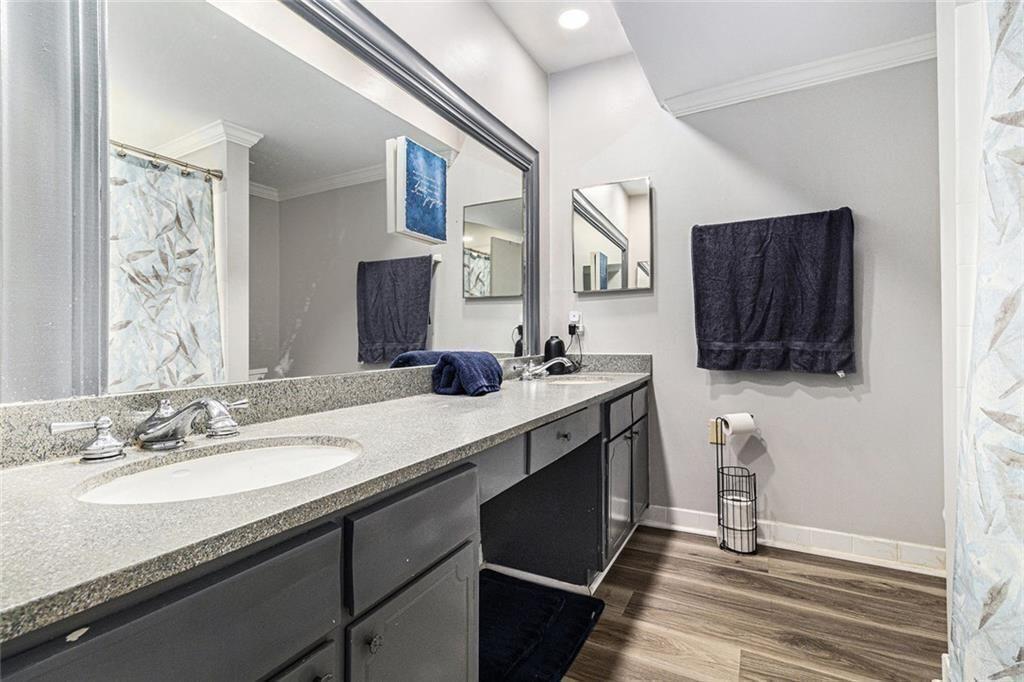 6851 Roswell Road, Unit M5 Atlanta, GA 30328 - Photo 14 of 21 a bathroom with a sink double vanity granite and a mirror