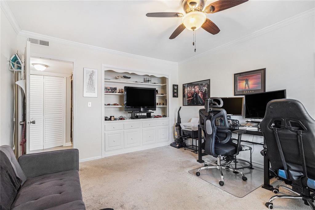6851 Roswell Road, Unit M5 Atlanta, GA 30328 - Photo 18 of 21 a view of a livingroom with workspace and a couch