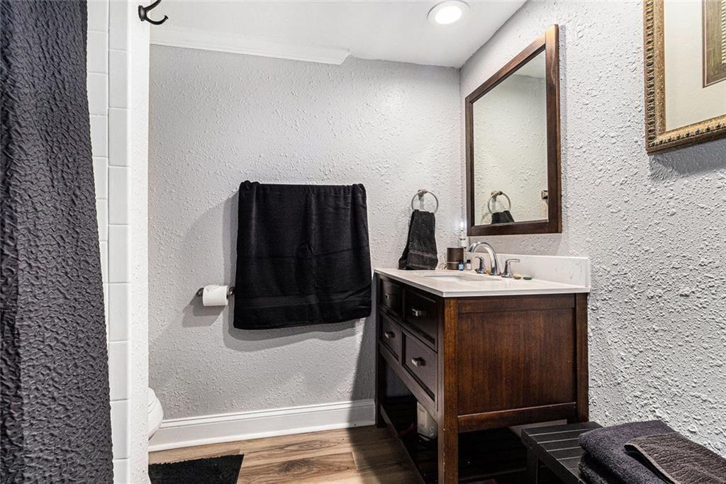6851 Roswell Road, Unit M5 Atlanta, GA 30328 - Photo 19 of 21 a bathroom with a sink and a mirror