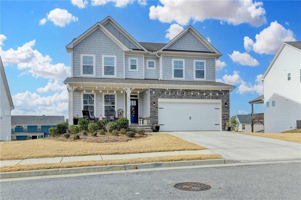 572 Redfish Way Hoschton, GA 30548 - Photo 1 of 67 a front view of a house with a yard