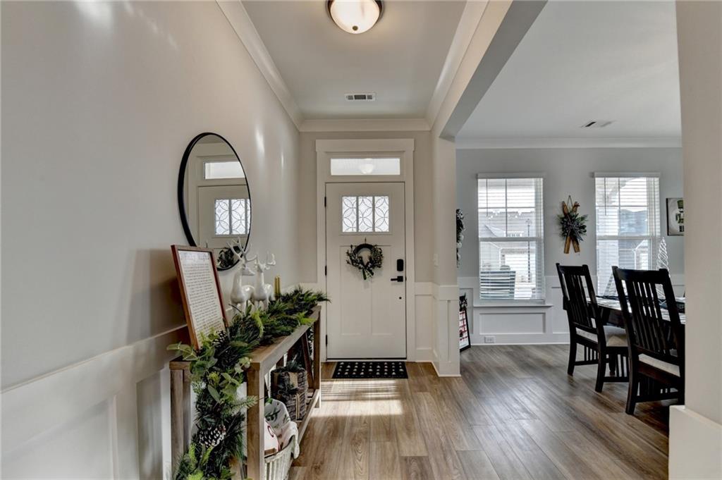 572 Redfish Way Hoschton, GA 30548 - Photo 3 of 67 a view of a livingroom with furniture and hardwood floor