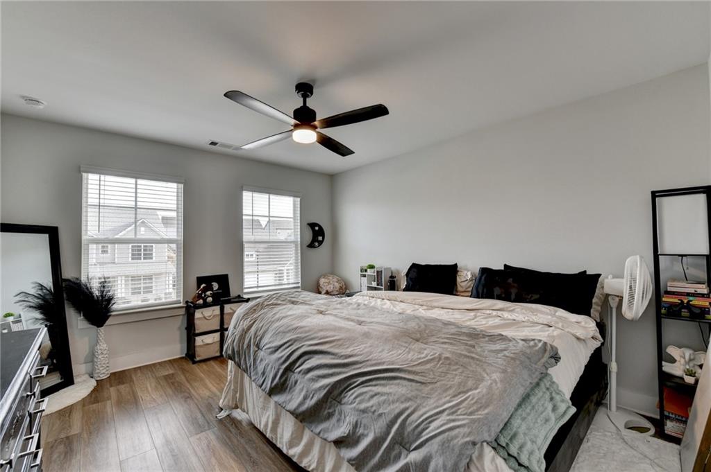 572 Redfish Way Hoschton, GA 30548 - Photo 44 of 67 a bedroom with a bed and a large window