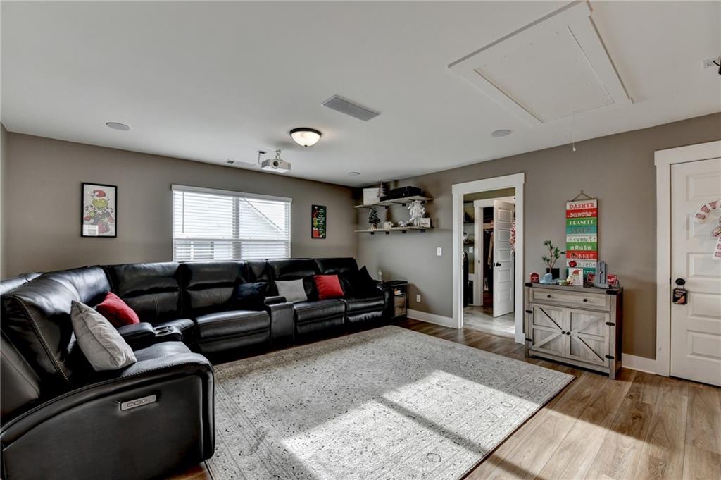 572 Redfish Way Hoschton, GA 30548 - Photo 49 of 67 a living room with furniture