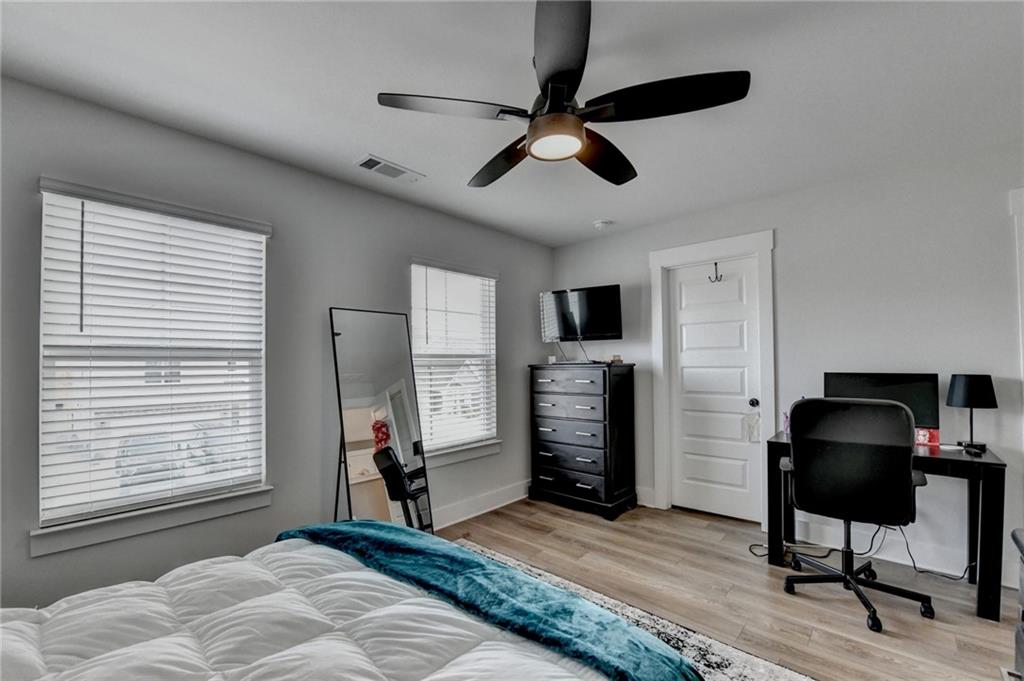 572 Redfish Way Hoschton, GA 30548 - Photo 53 of 67 a bedroom with furniture and a window