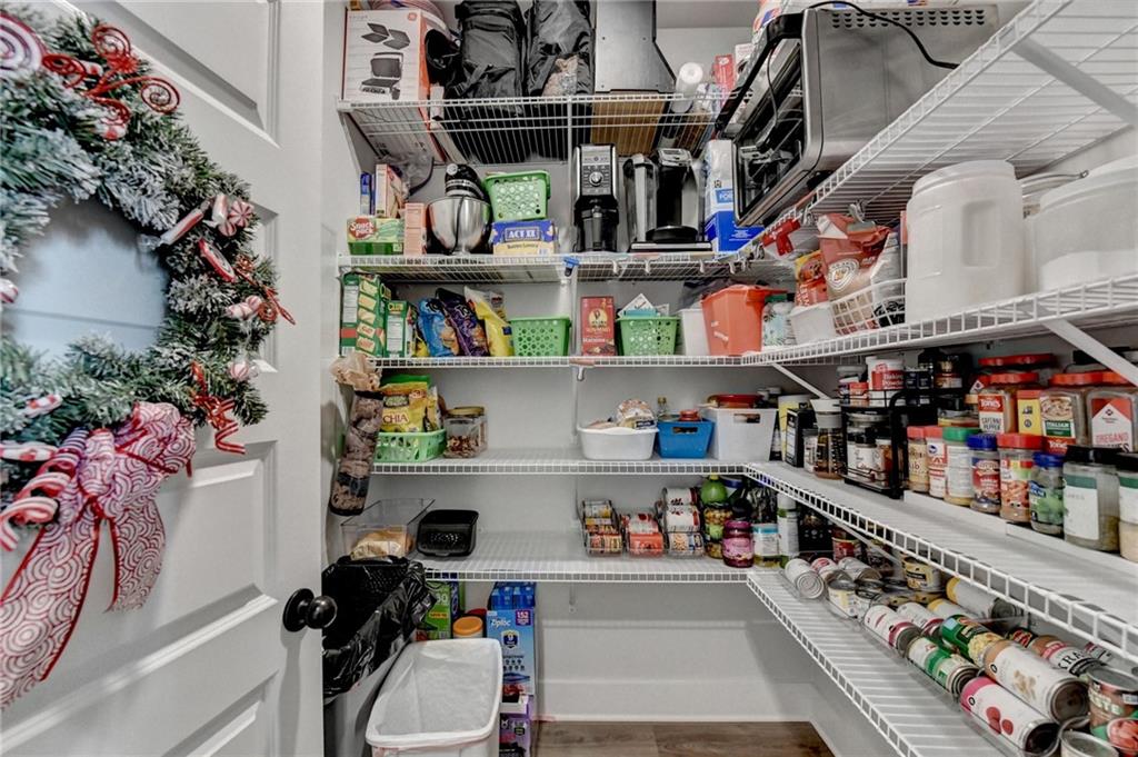 572 Redfish Way Hoschton, GA 30548 - Photo 56 of 67 a room with lots of different colored cloths