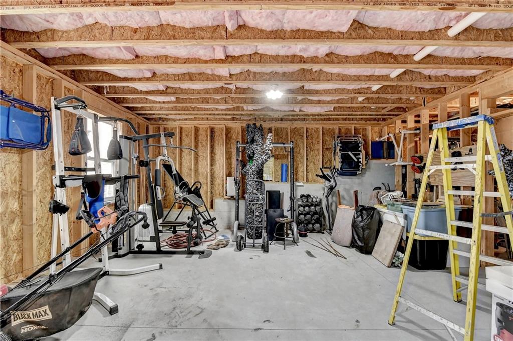 572 Redfish Way Hoschton, GA 30548 - Photo 65 of 67 a view of a room with gym equipment