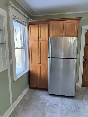 a view of a refrigerator in a kitchen
