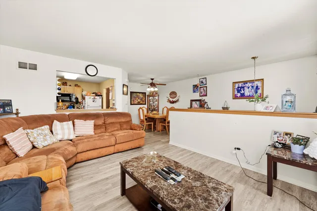 a living room with furniture and a rug
