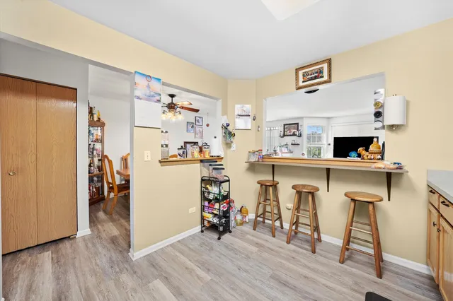 a view of dining room with furniture and wooden floor