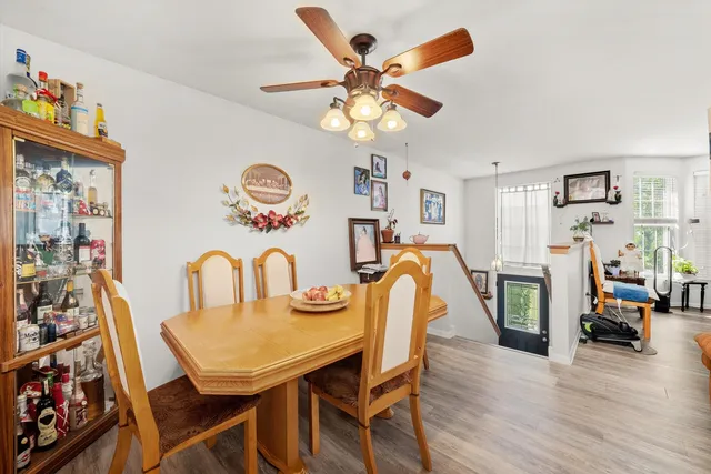 a view of a dining room with furniture and wooden floor