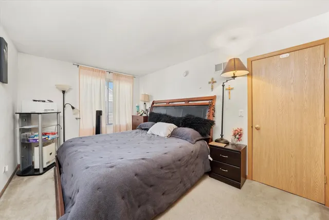 a bedroom with a bed and a closet