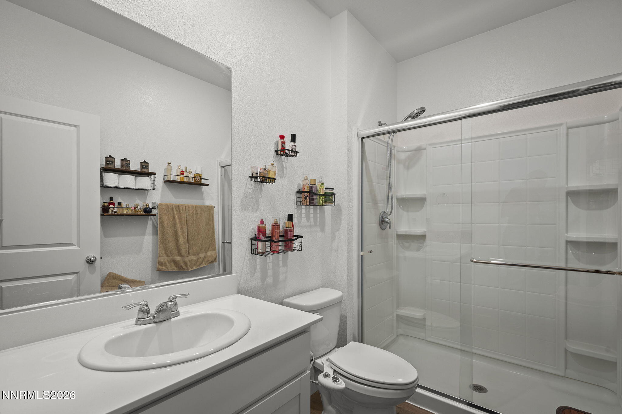 738 Butte Creek Road Dayton, NV 89403 - Photo 19 of 28 a bathroom with a sink toilet and shower