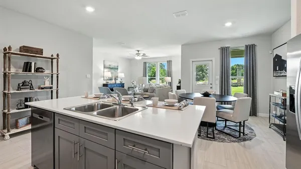 a kitchen with a sink stove and refrigerator