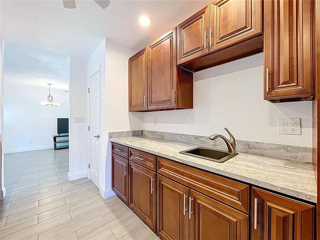 a living room with furniture and large windows