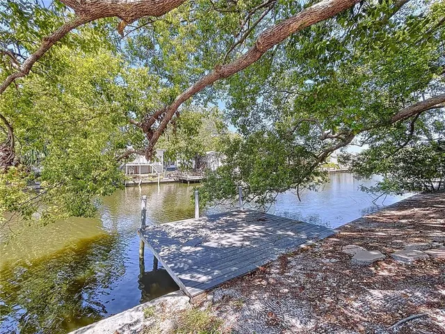a view of a wooden deck and lake view