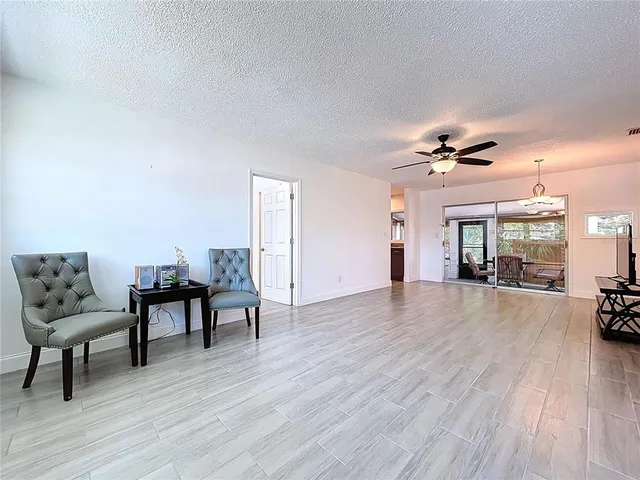 a view of a livingroom with furniture and wooden floor