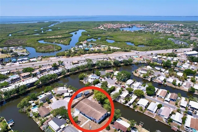an aerial view of a city with a lake view