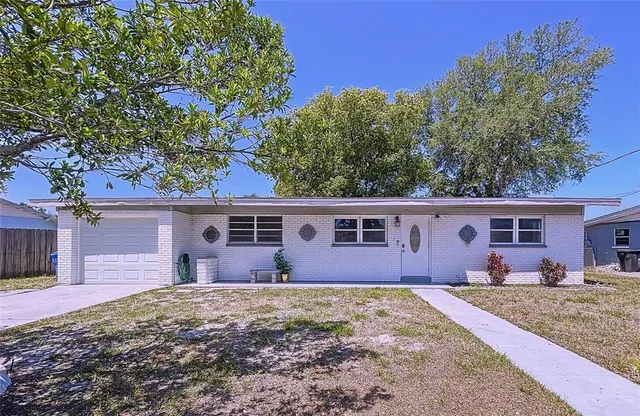 front view of a house with a yard