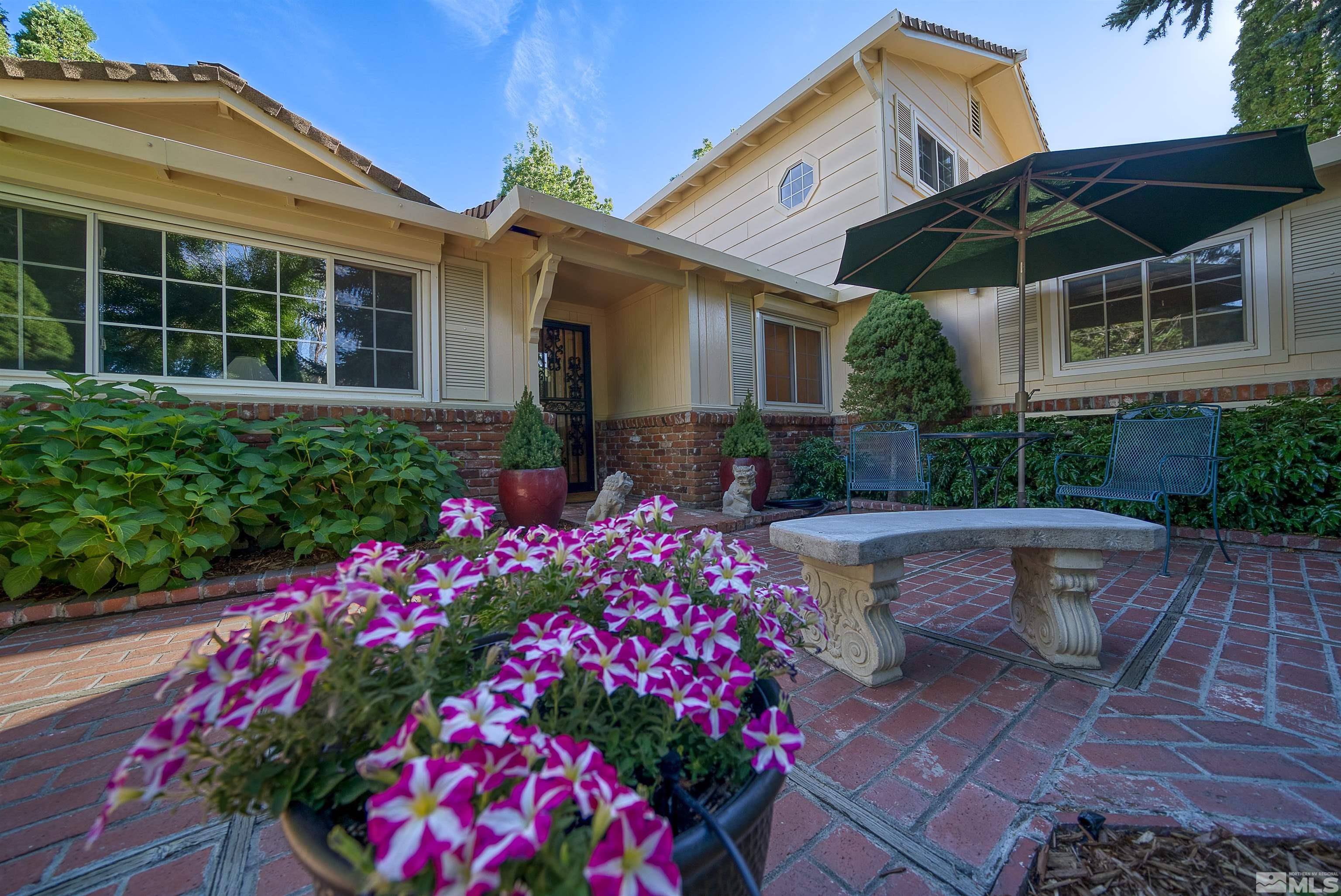1730 West 6th Street Reno, NV 89503 - Photo 1 of 25 a front view of a house with a yard and fountain