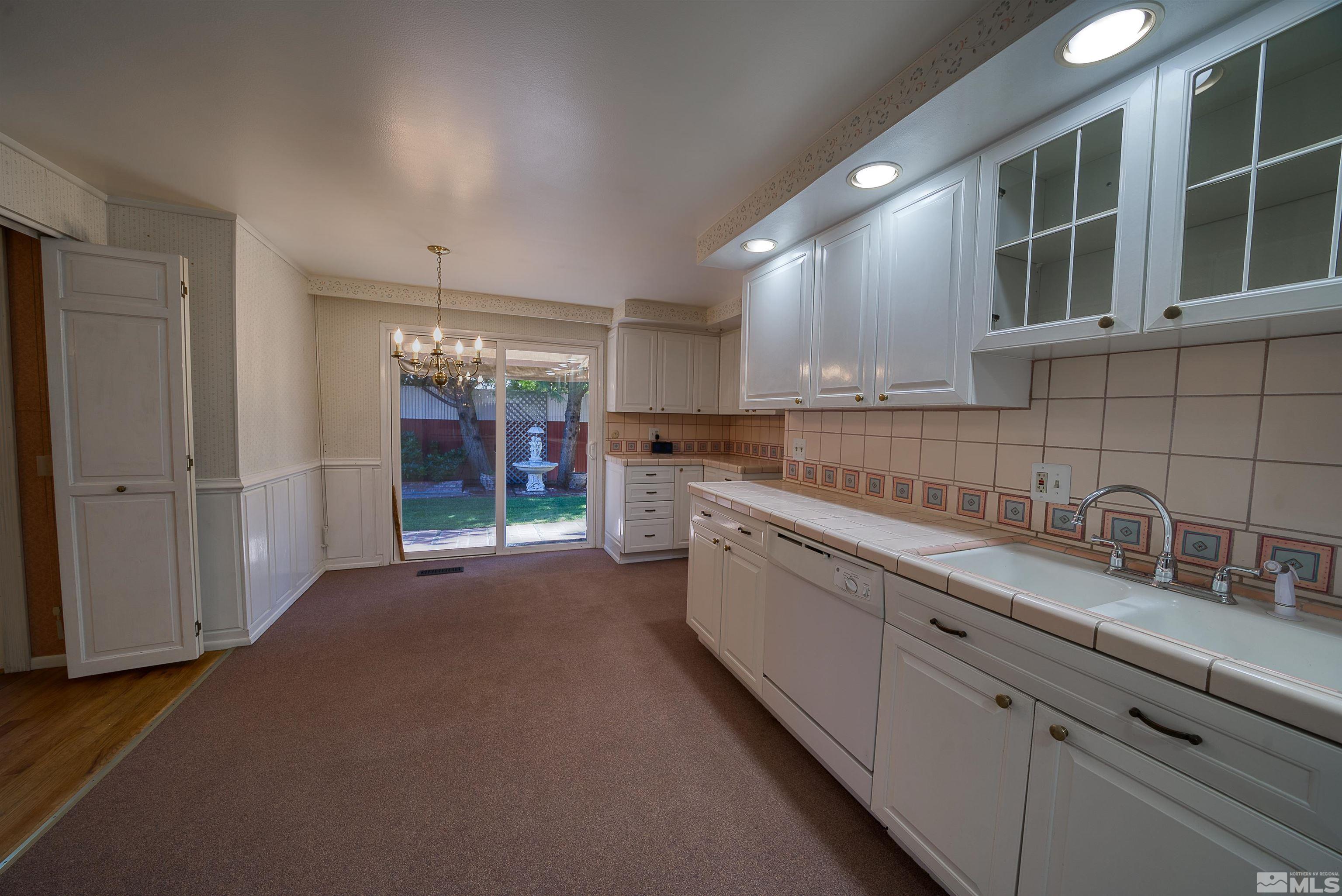1730 West 6th Street Reno, NV 89503 - Photo 13 of 25 a kitchen with a sink and cabinets