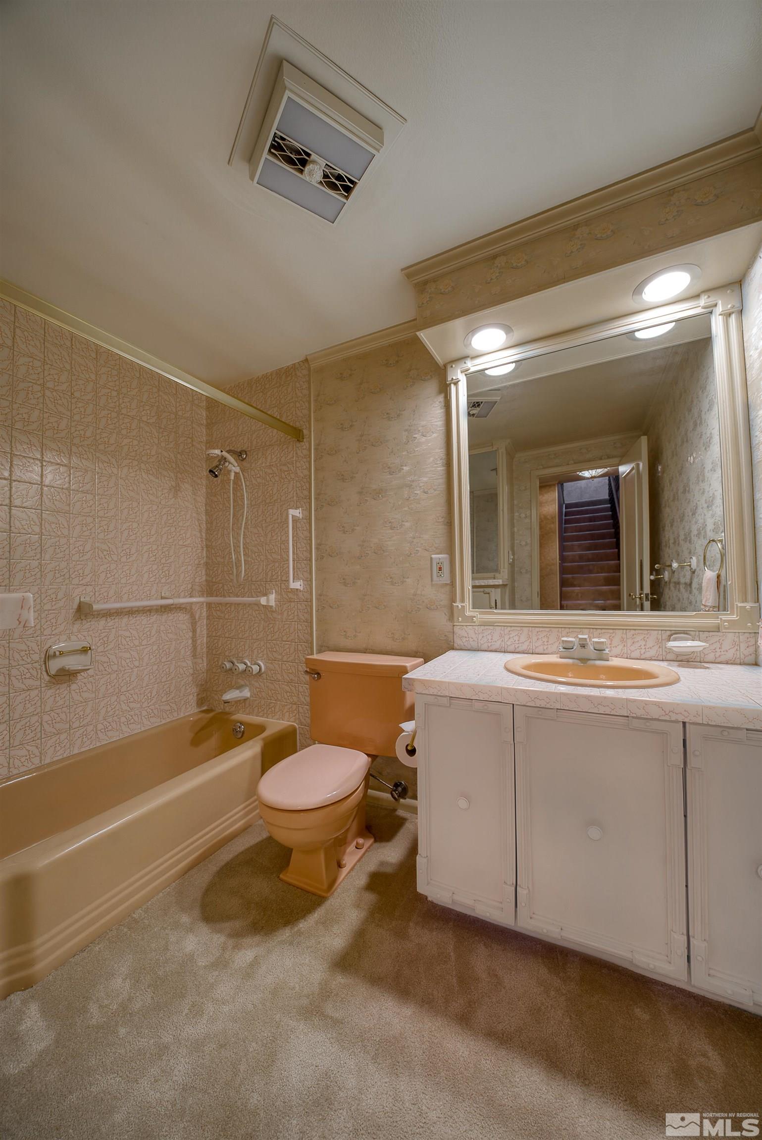 1730 West 6th Street Reno, NV 89503 - Photo 21 of 25 a bathroom with a sink a toilet and shower
