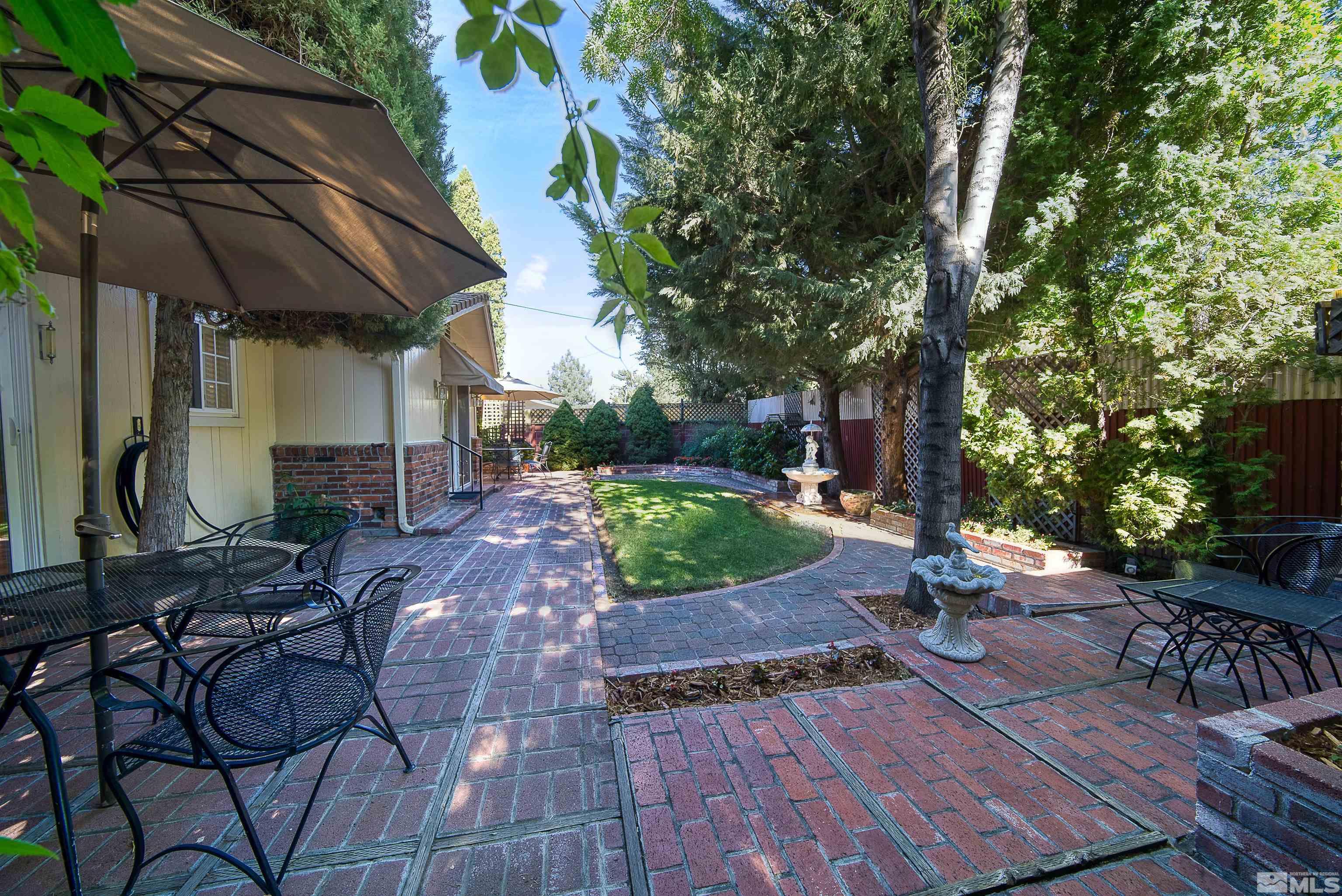 1730 West 6th Street Reno, NV 89503 - Photo 6 of 25 a view of backyard with outdoor seating and trees