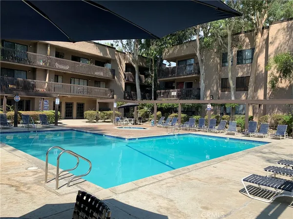 a view of a swimming pool with sitting area