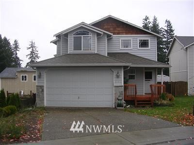 6701 Lower Ridge Road Everett, WA 98203 - Photo 1 of 1 a front view of a house with a yard