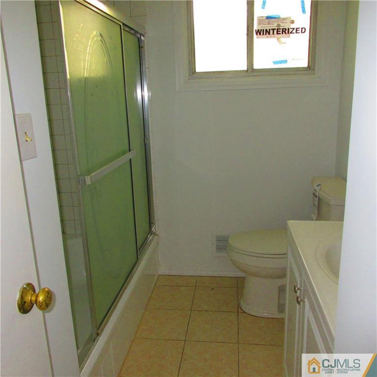 19 North Pennington Road New Brunswick, NJ 08901 - Photo 5 of 10 a bathroom with a toilet and a shower