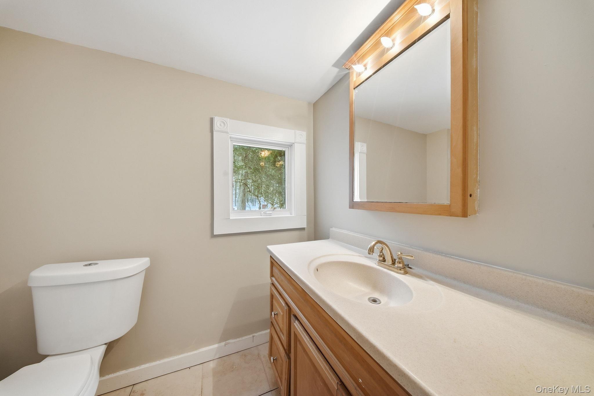54 Lime Kiln Road Port Jervis, NY 12771 - Photo 19 of 34 a bathroom with a sink and a toilet