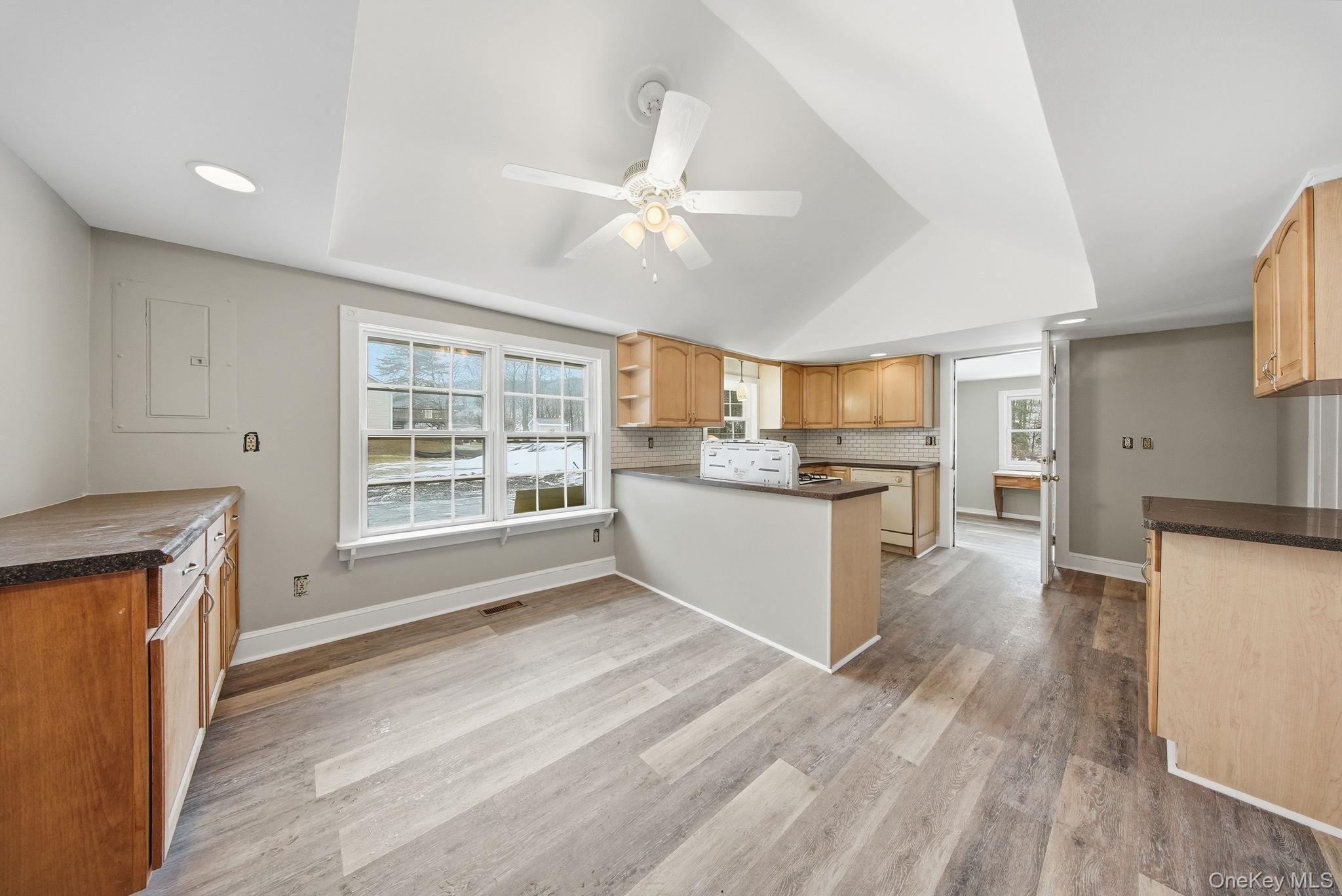 54 Lime Kiln Road Port Jervis, NY 12771 - Photo 22 of 34 a view of a kitchen with a sink a refrigerator and window