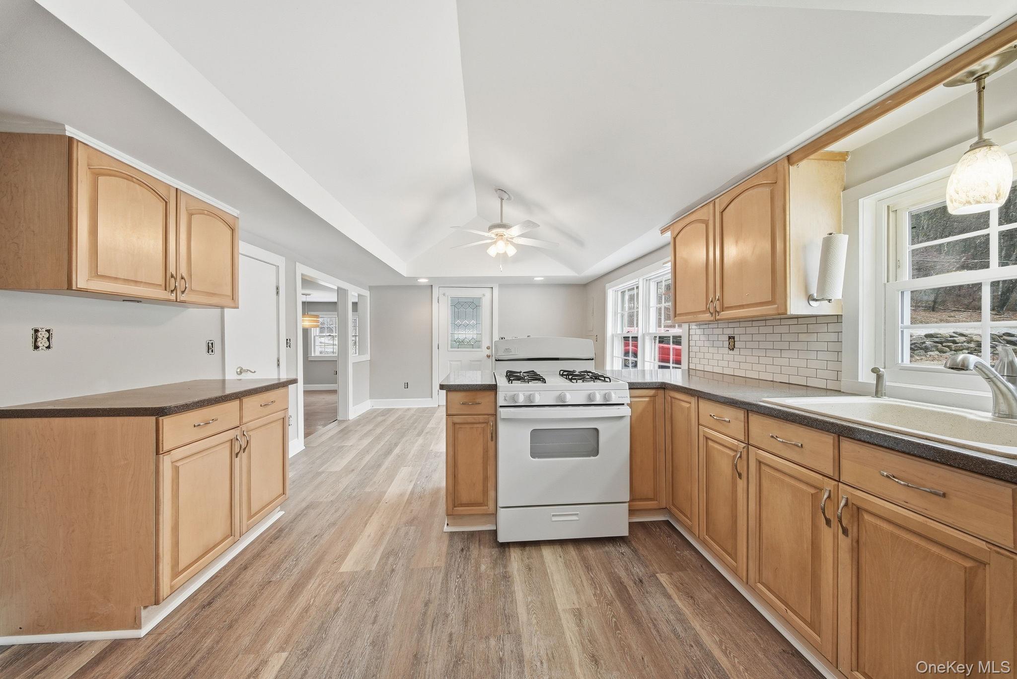 54 Lime Kiln Road Port Jervis, NY 12771 - Photo 25 of 34 a large kitchen with cabinets wooden floor and stainless steel appliances