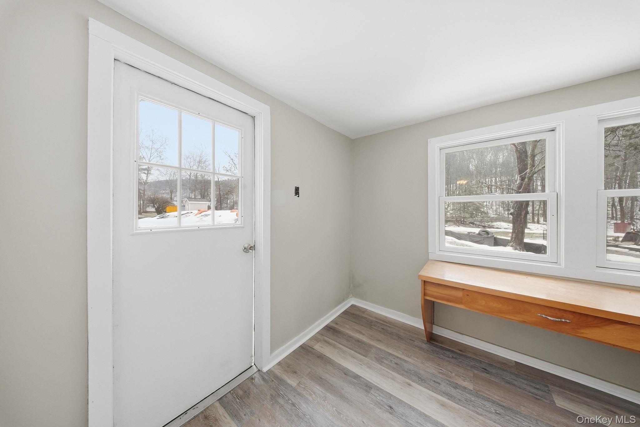 54 Lime Kiln Road Port Jervis, NY 12771 - Photo 26 of 34 a view of a room with wooden floor and windows