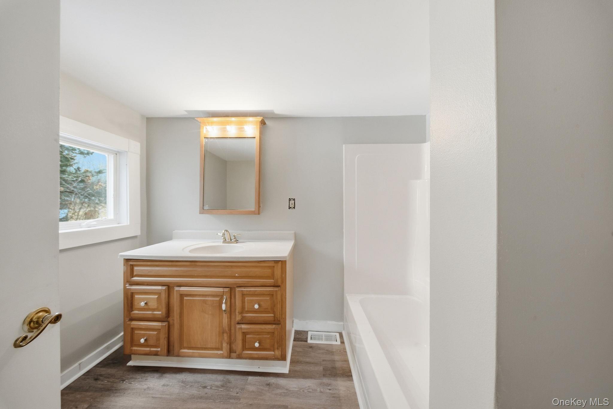 54 Lime Kiln Road Port Jervis, NY 12771 - Photo 28 of 34 a bathroom with a sink and a mirror