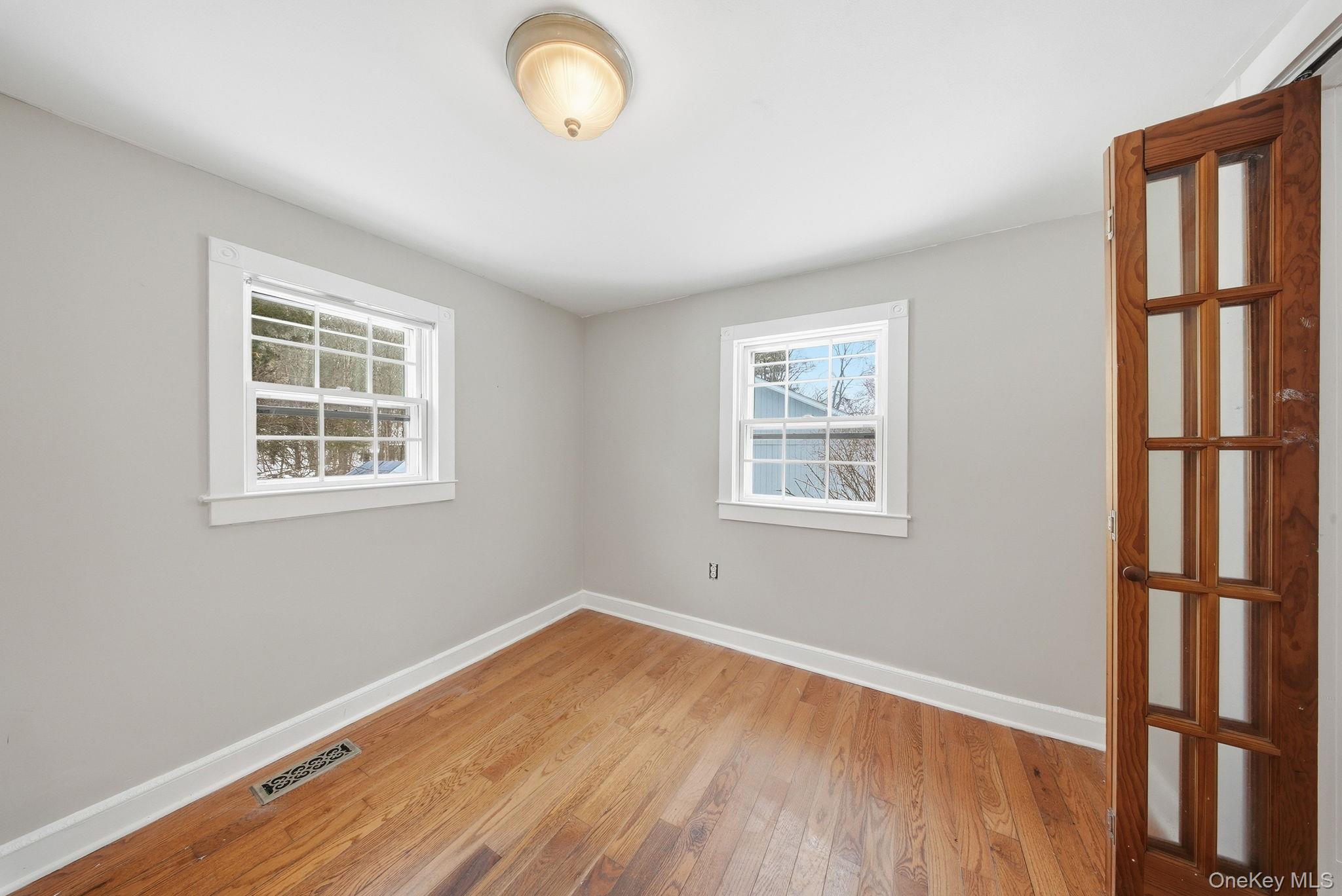 54 Lime Kiln Road Port Jervis, NY 12771 - Photo 9 of 34 a view of a room with wooden floor and windows