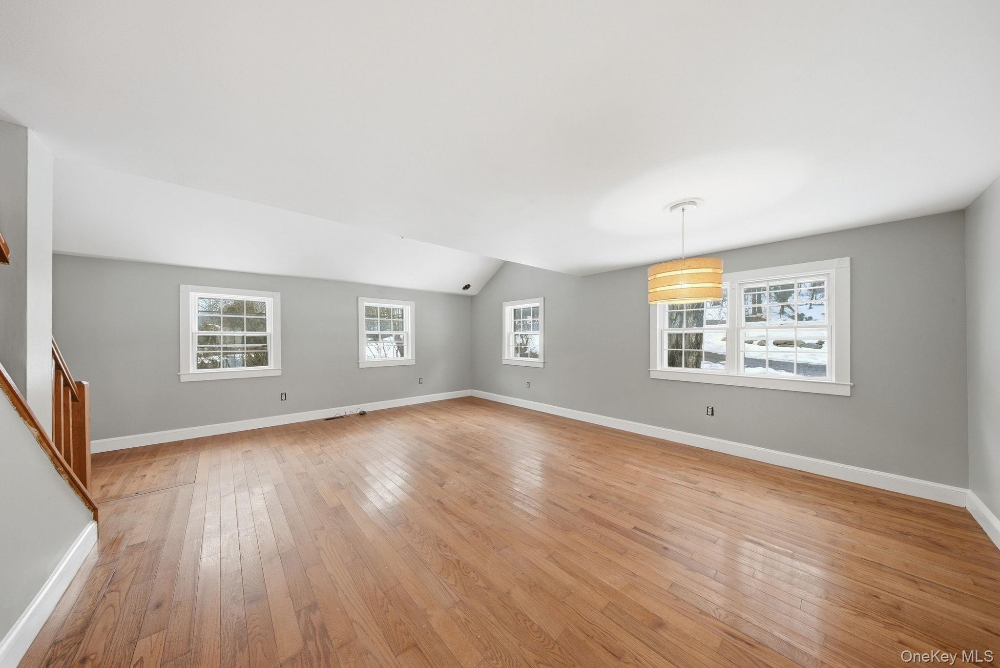 54 Lime Kiln Road Port Jervis, NY 12771 - Photo 10 of 34 an empty room with wooden floor and windows