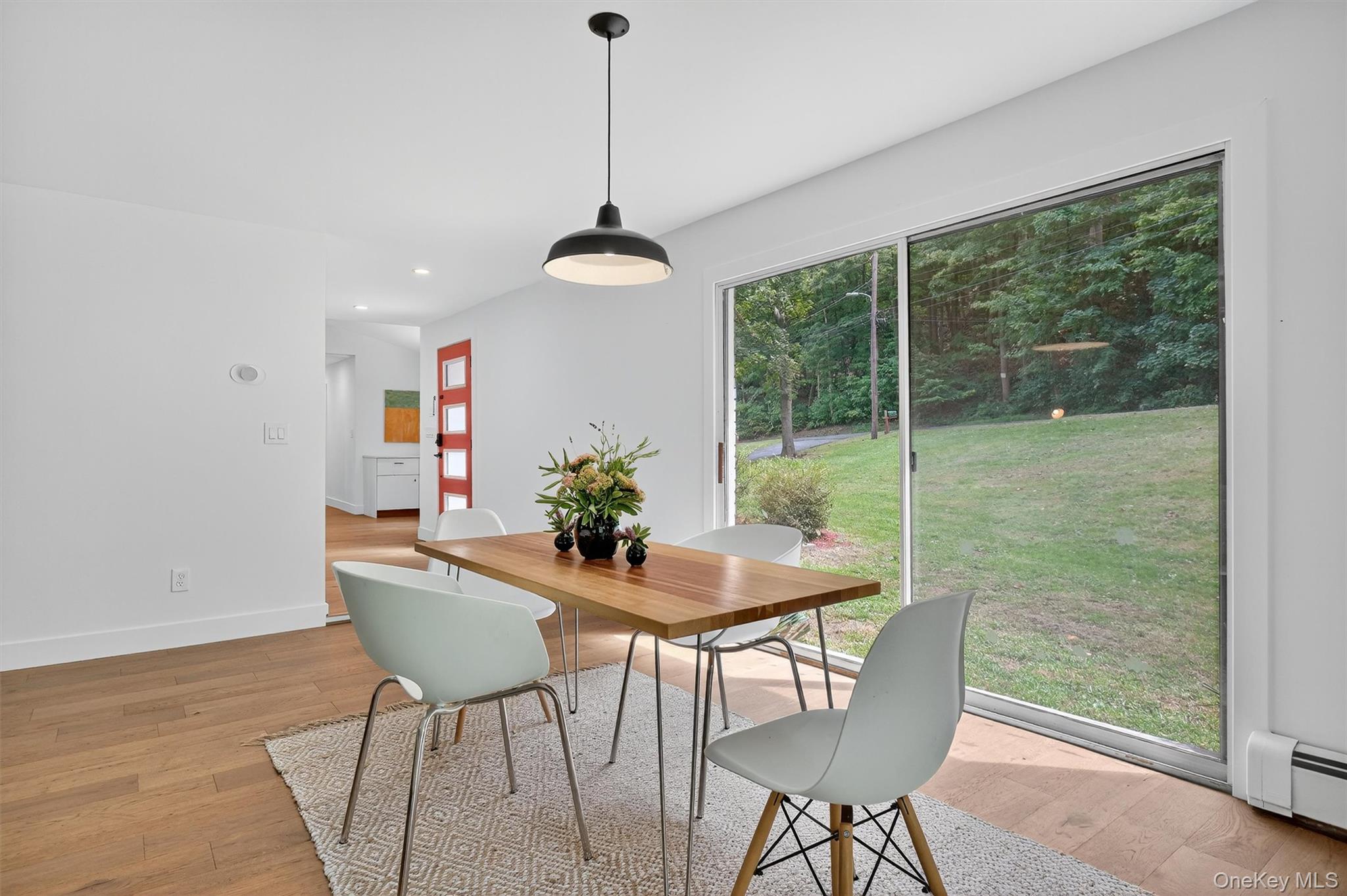 15 Fairview Road Beacon, NY 12508 - Photo 16 of 41 Dining room featuring light wood finished floors, plenty of natural light, a baseboard heating unit, and recessed lighting