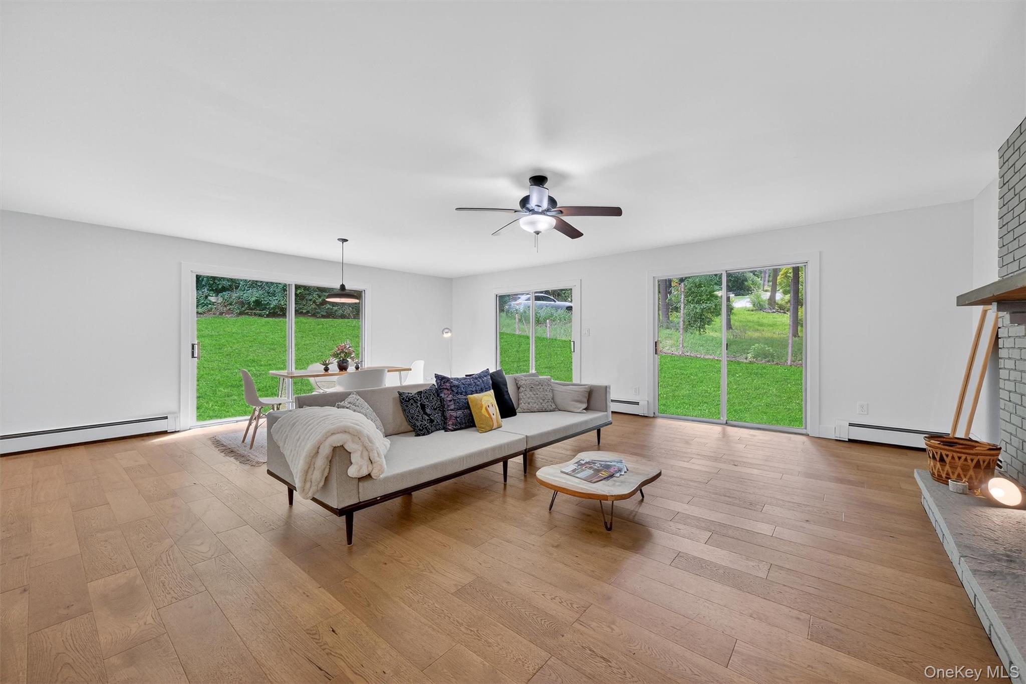 15 Fairview Road Beacon, NY 12508 - Photo 19 of 41 Living room with light wood-type flooring, healthy amount of natural light, and a baseboard heating unit