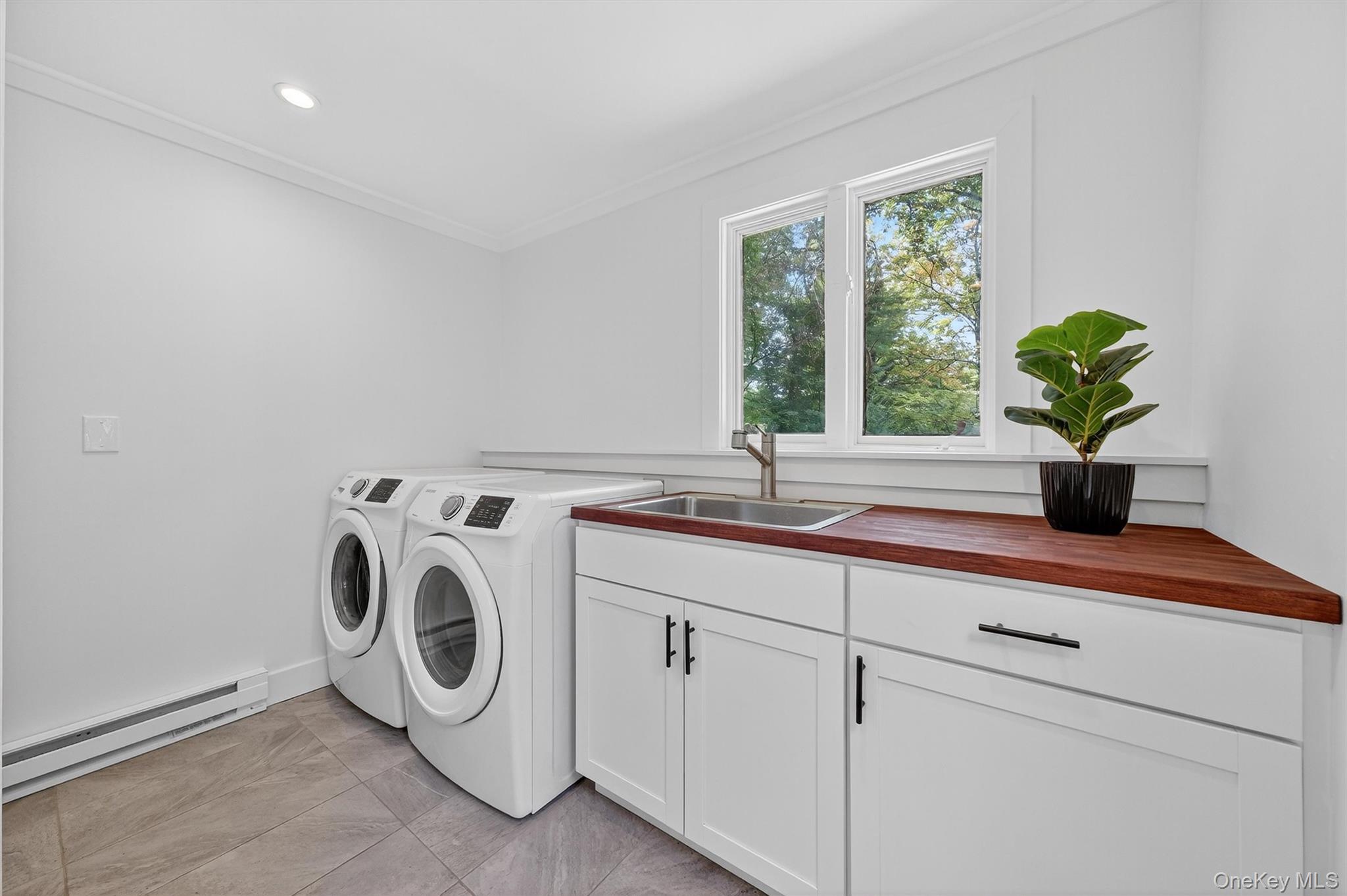 15 Fairview Road Beacon, NY 12508 - Photo 30 of 41 Washroom featuring a baseboard radiator, washer and clothes dryer, ornamental molding, cabinet space, and recessed lighting