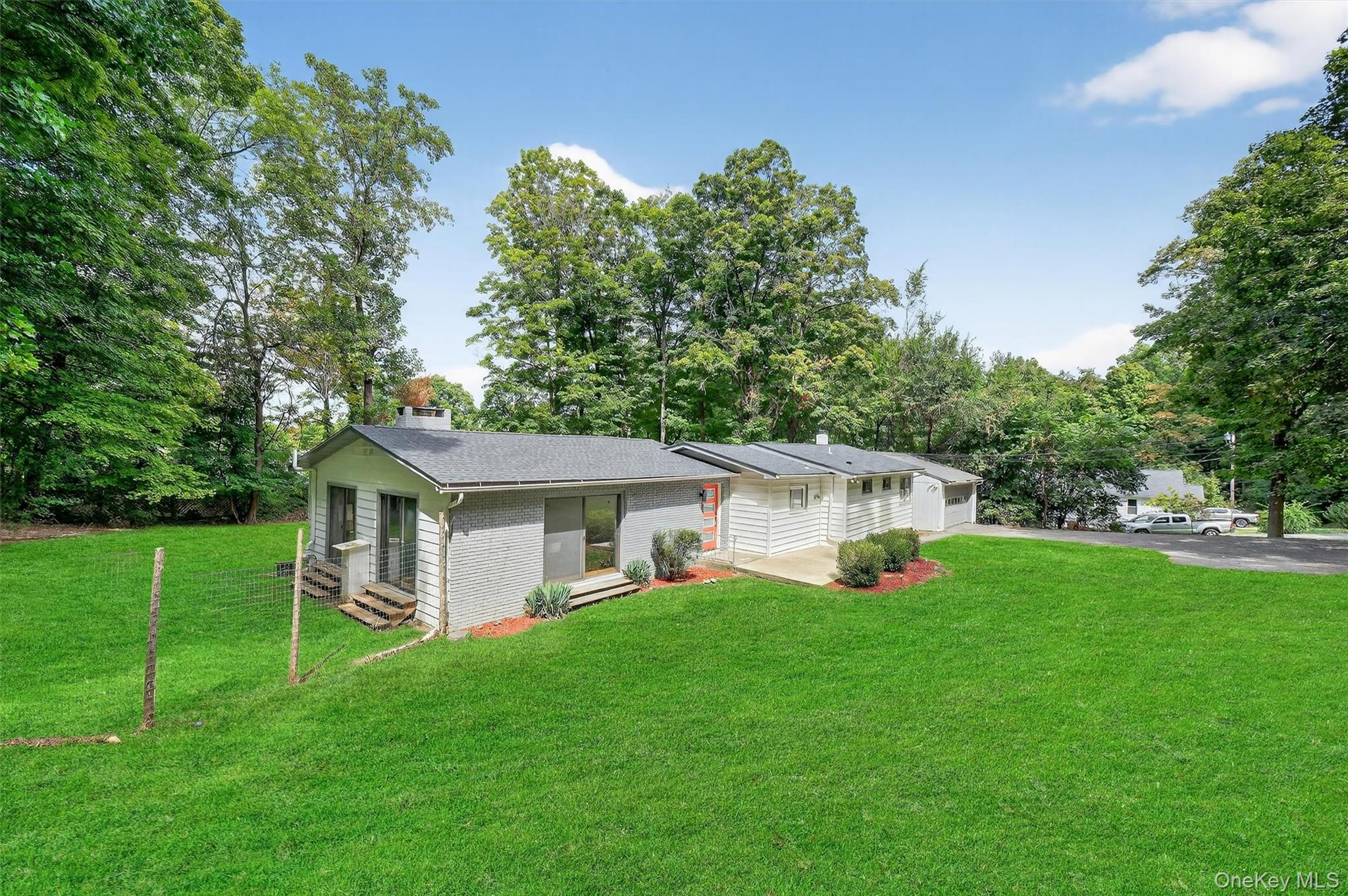 15 Fairview Road Beacon, NY 12508 - Photo 3 of 41 View of front of home featuring a front lawn, driveway, entry steps, a chimney, and an attached garage