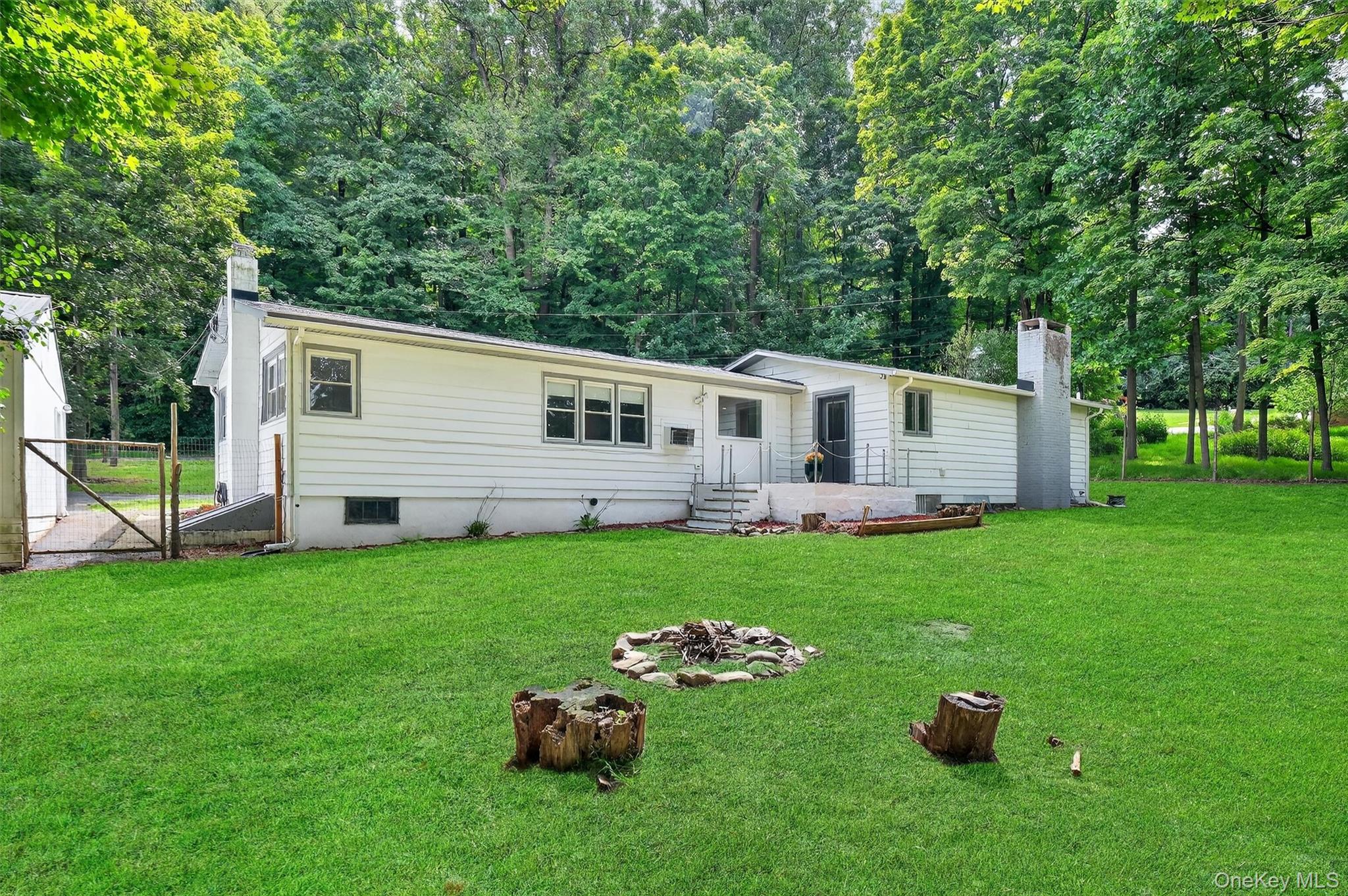 15 Fairview Road Beacon, NY 12508 - Photo 36 of 41 Rear view of property featuring a yard, a chimney, and an outbuilding