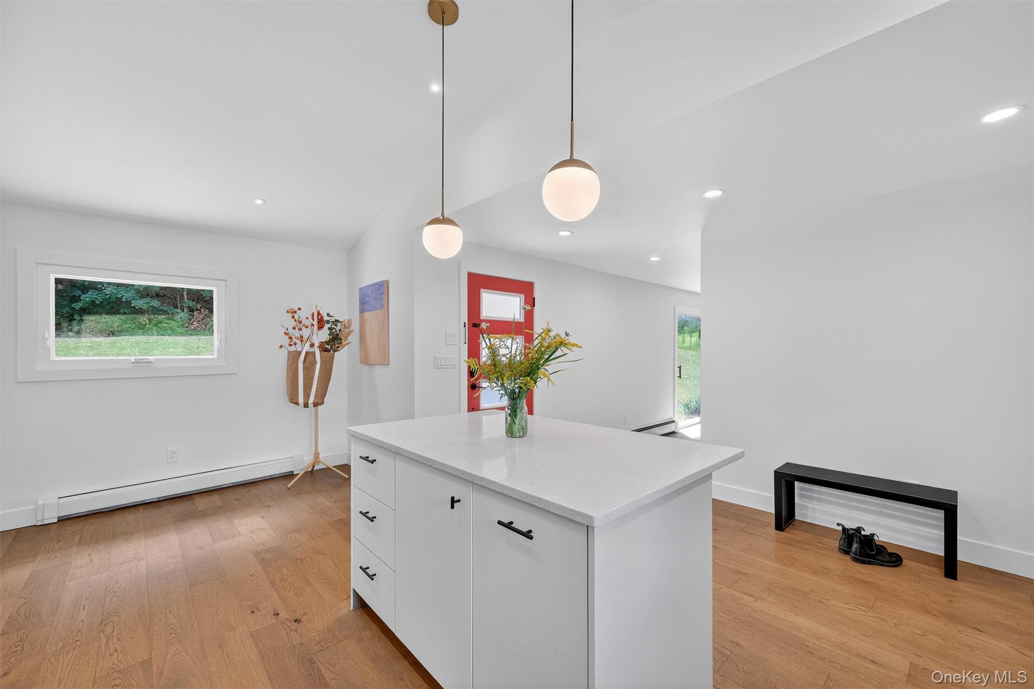 15 Fairview Road Beacon, NY 12508 - Photo 8 of 41 Kitchen with white cabinetry, a baseboard radiator, hanging light fixtures, plenty of natural light, and recessed lighting