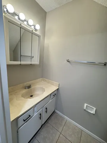 a kitchen with a sink stainless steel appliances and cabinets