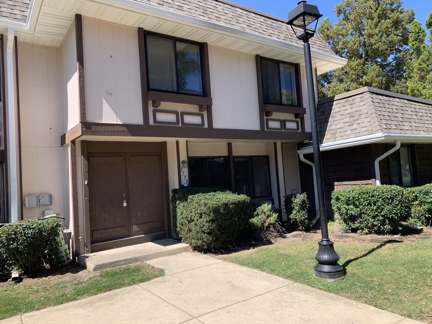 5573 Court F Hanover Park, IL 60133 - Photo 1 of 21 a front view of a house with garden