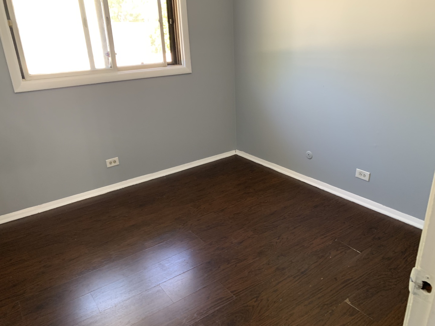 5573 Court F Hanover Park, IL 60133 - Photo 17 of 21 an empty room with wooden floor and windows