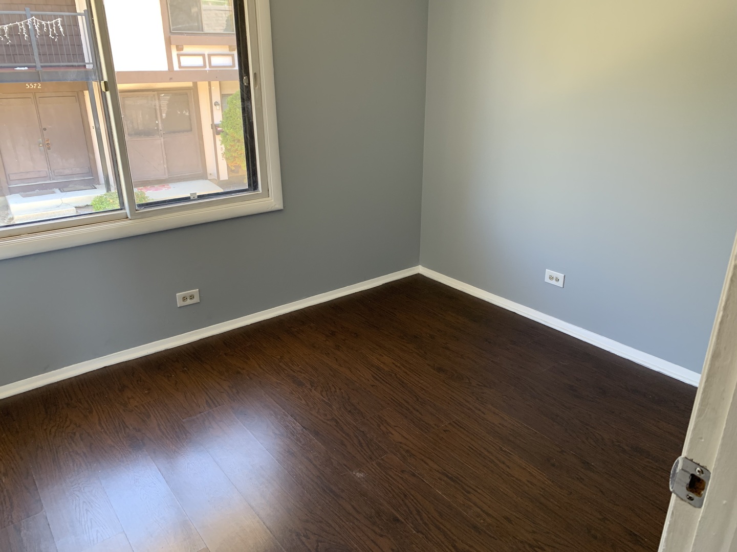 5573 Court F Hanover Park, IL 60133 - Photo 18 of 21 an empty room with wooden floor and windows