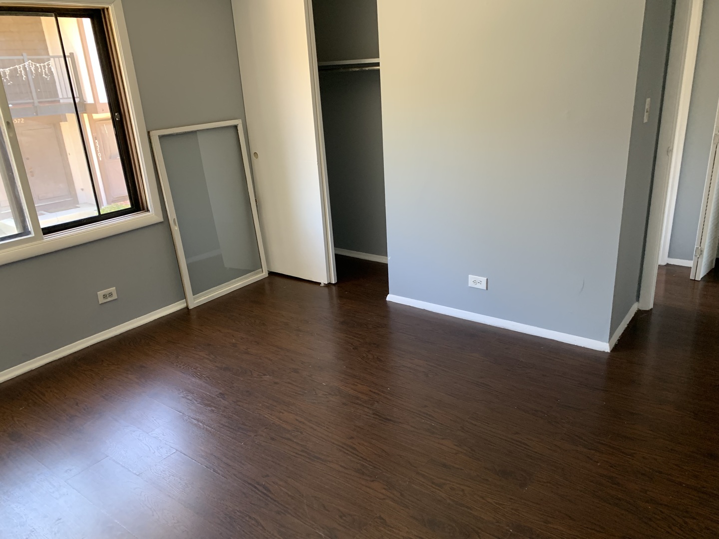 5573 Court F Hanover Park, IL 60133 - Photo 19 of 21 an empty room with wooden floor and windows