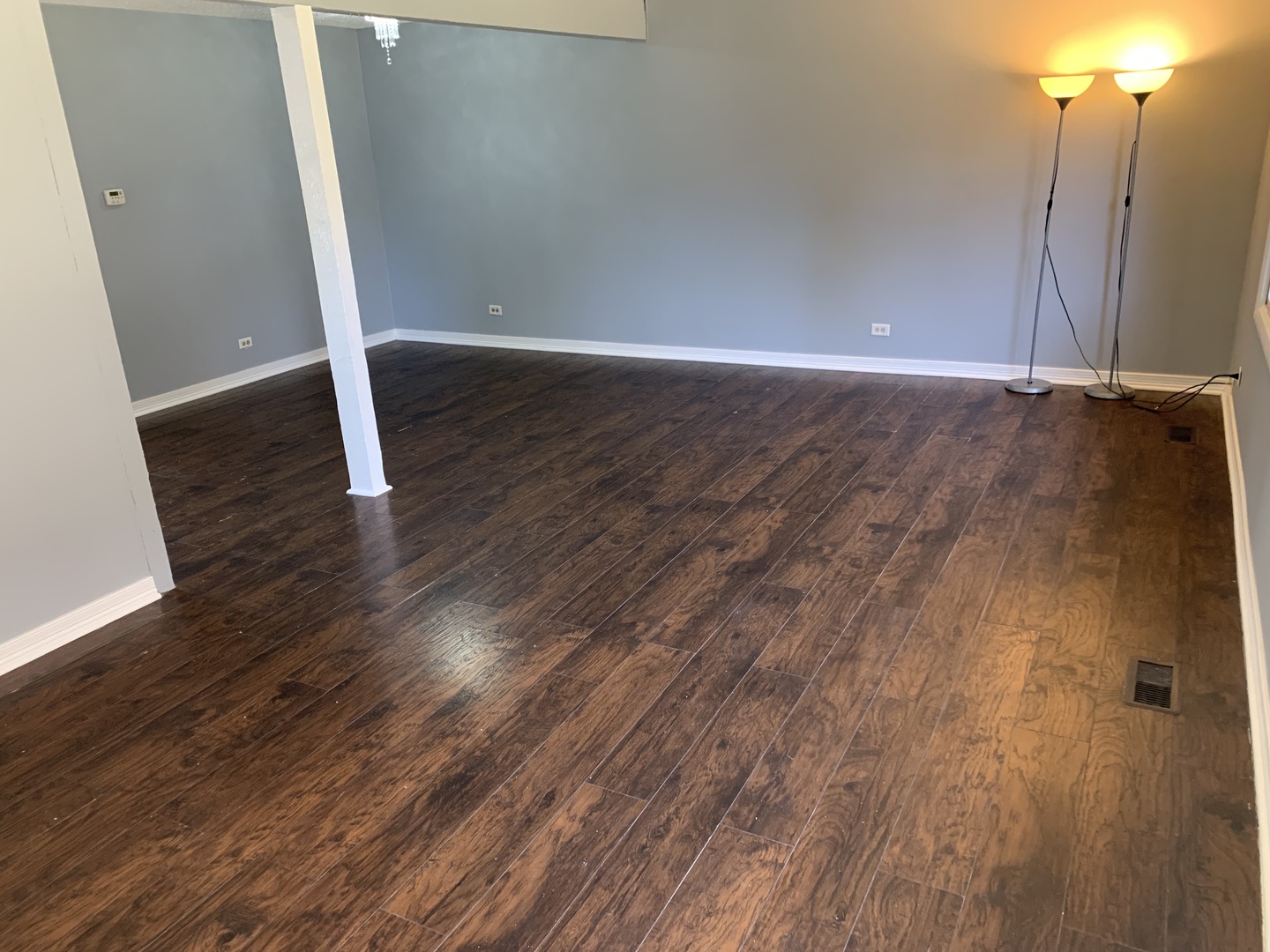 5573 Court F Hanover Park, IL 60133 - Photo 4 of 21 a view of an empty room with wooden floor