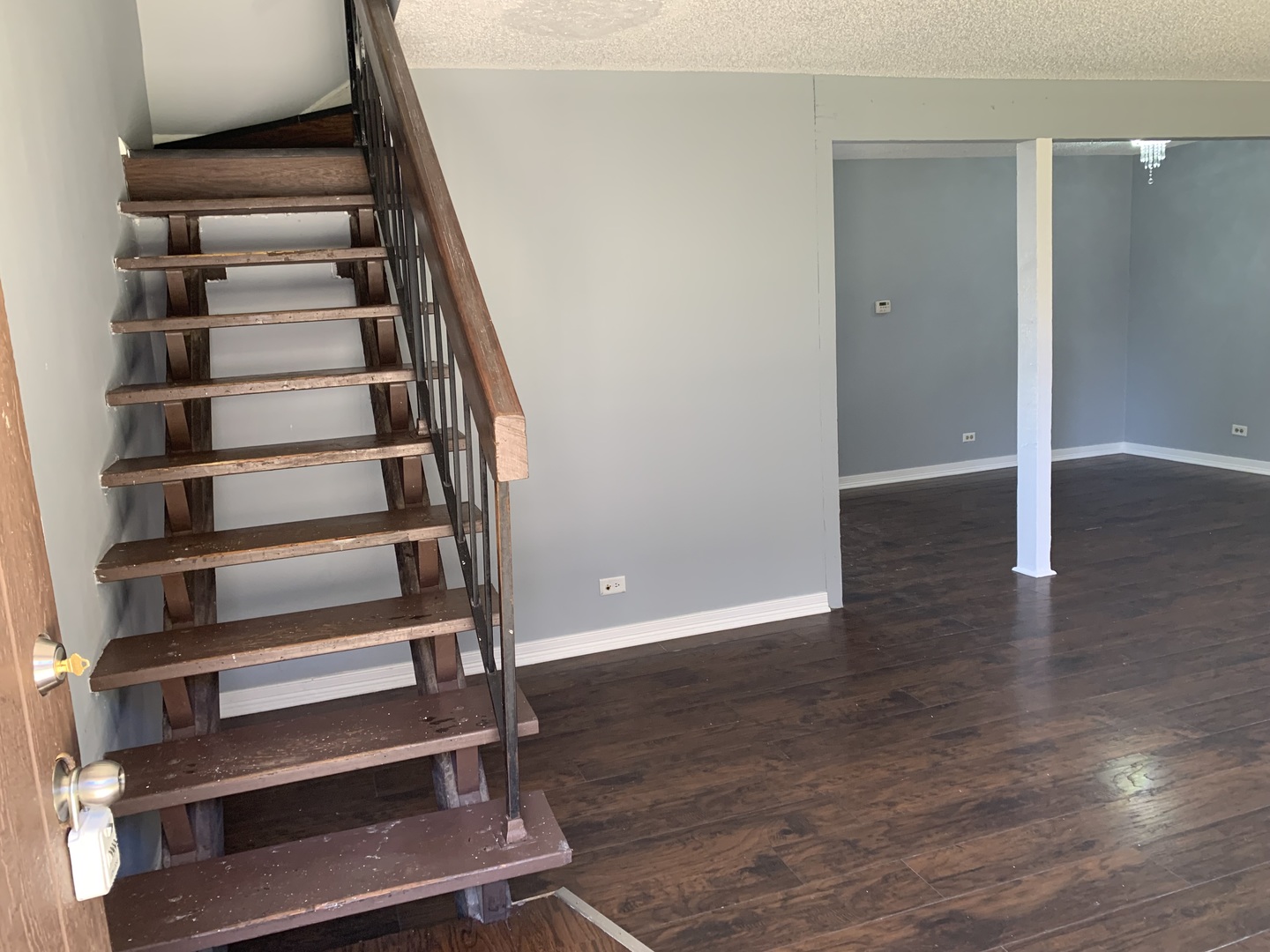 5573 Court F Hanover Park, IL 60133 - Photo 5 of 21 a view of staircase with wooden floor and white walls