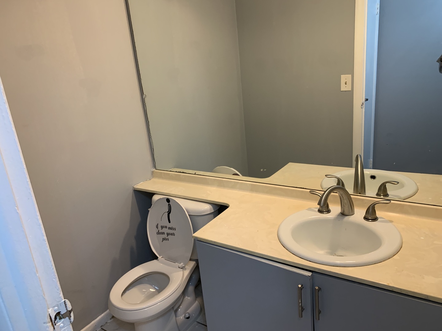 5573 Court F Hanover Park, IL 60133 - Photo 8 of 21 a bathroom with a toilet sink and mirror